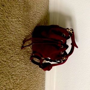 Ann Taylor burgandy suede handbag. Short handle or removable shoulder strap.